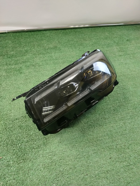 Фара левая Geely Monjaro 7051047300